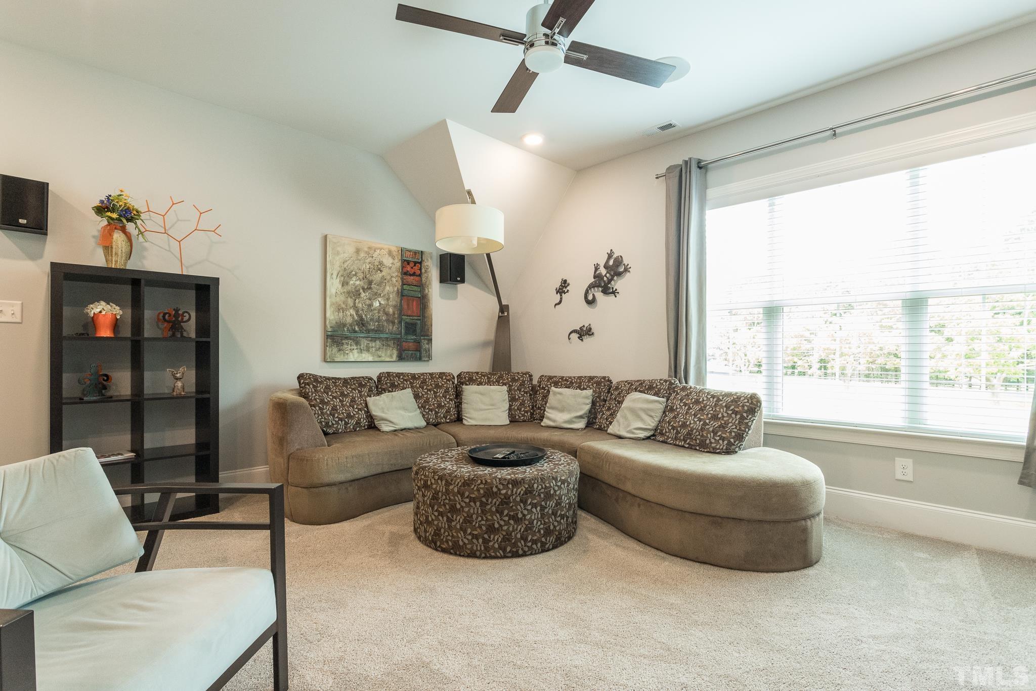 9117 Penny Road Raleigh, NC 27606 - Photo 23 of 54 a living room with furniture and a large window