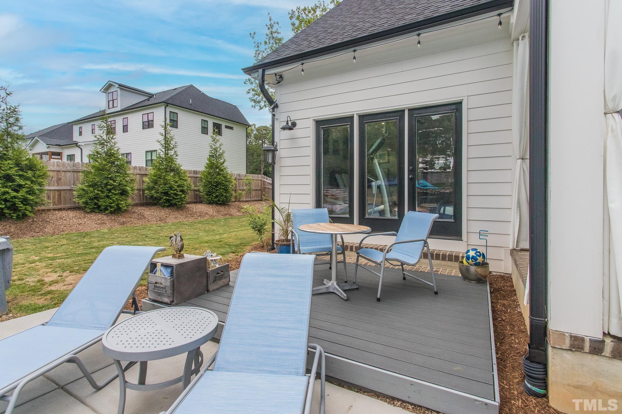 9117 Penny Road Raleigh, NC 27606 - Photo 32 of 54 a view of a patio with couches chairs and potted plants