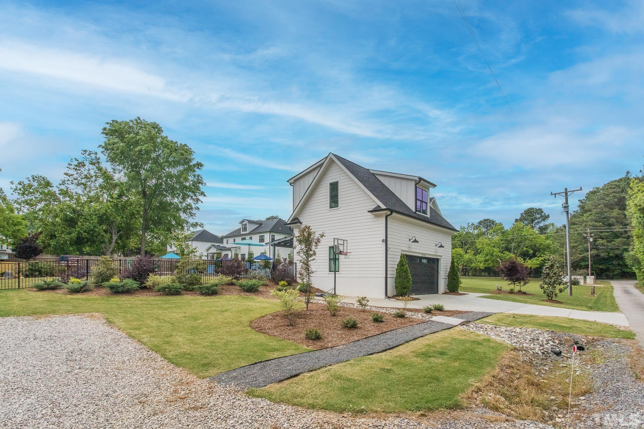 9117 Penny Road Raleigh, NC 27606 - Photo 33 of 54 a view of a house with a yard