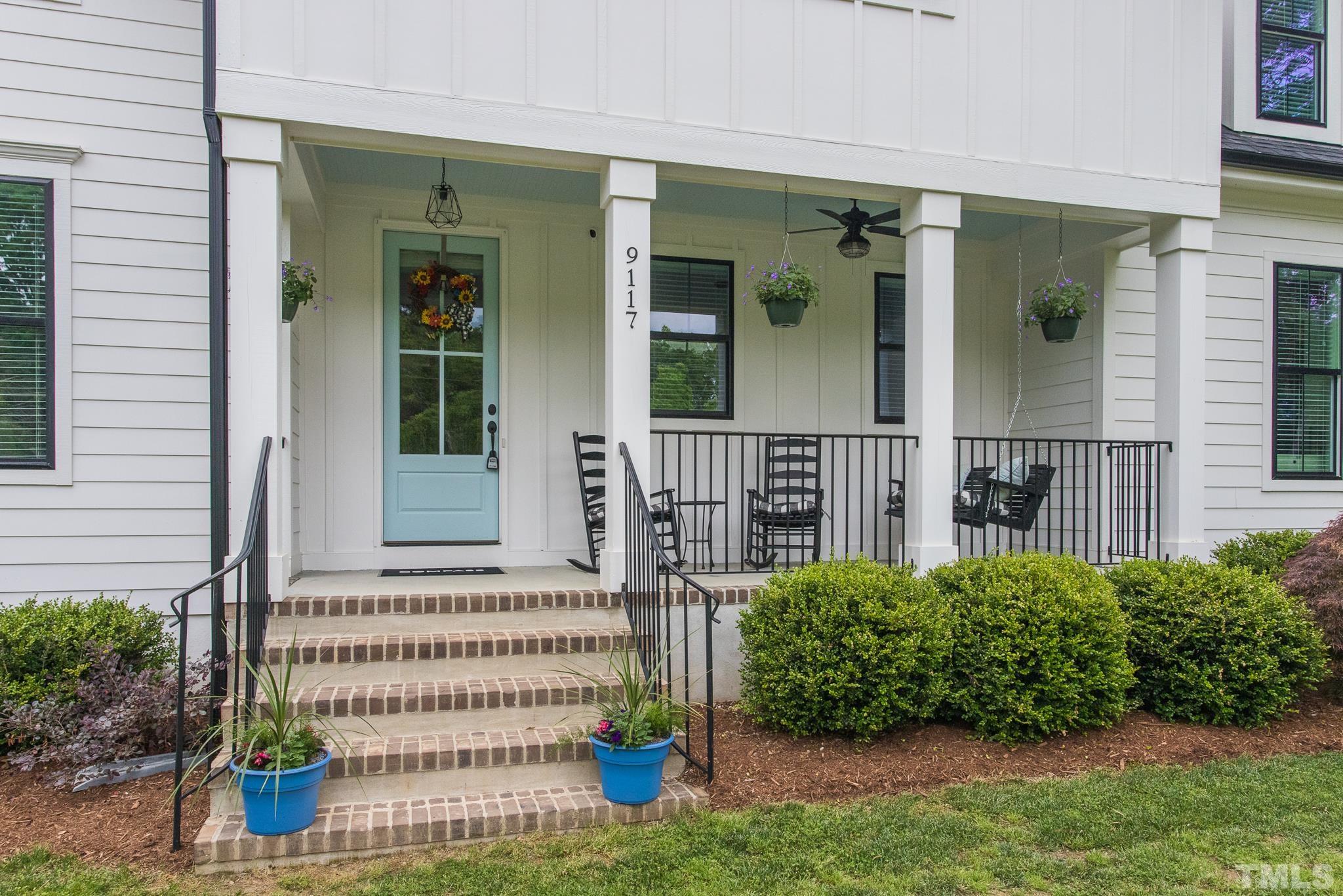 9117 Penny Road Raleigh, NC 27606 - Photo 34 of 54 front view of a house with a porch