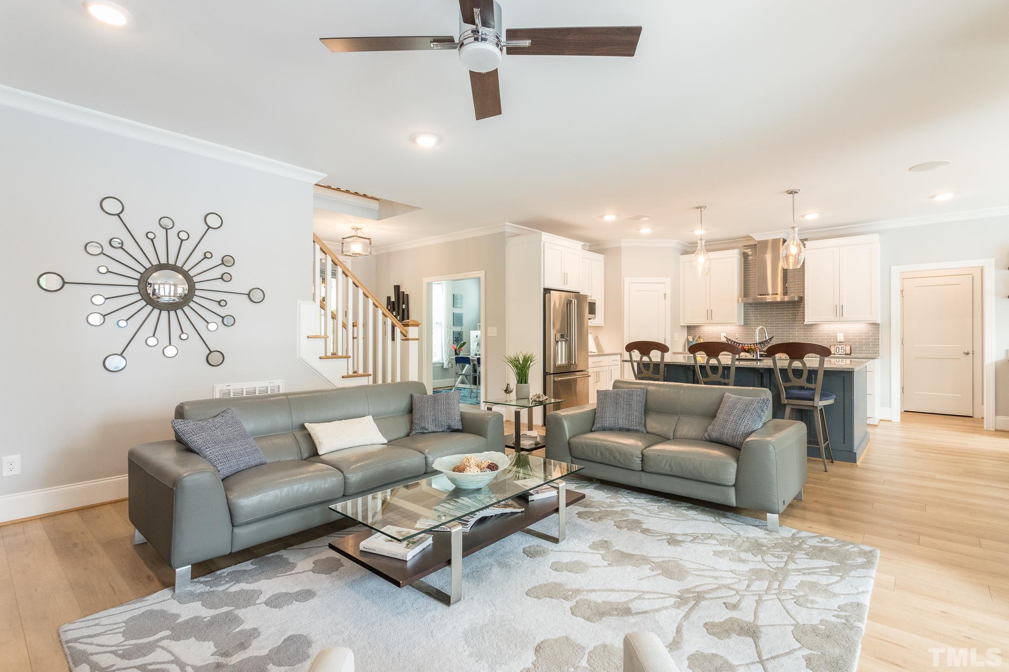 9117 Penny Road Raleigh, NC 27606 - Photo 35 of 54 a living room with furniture and kitchen view