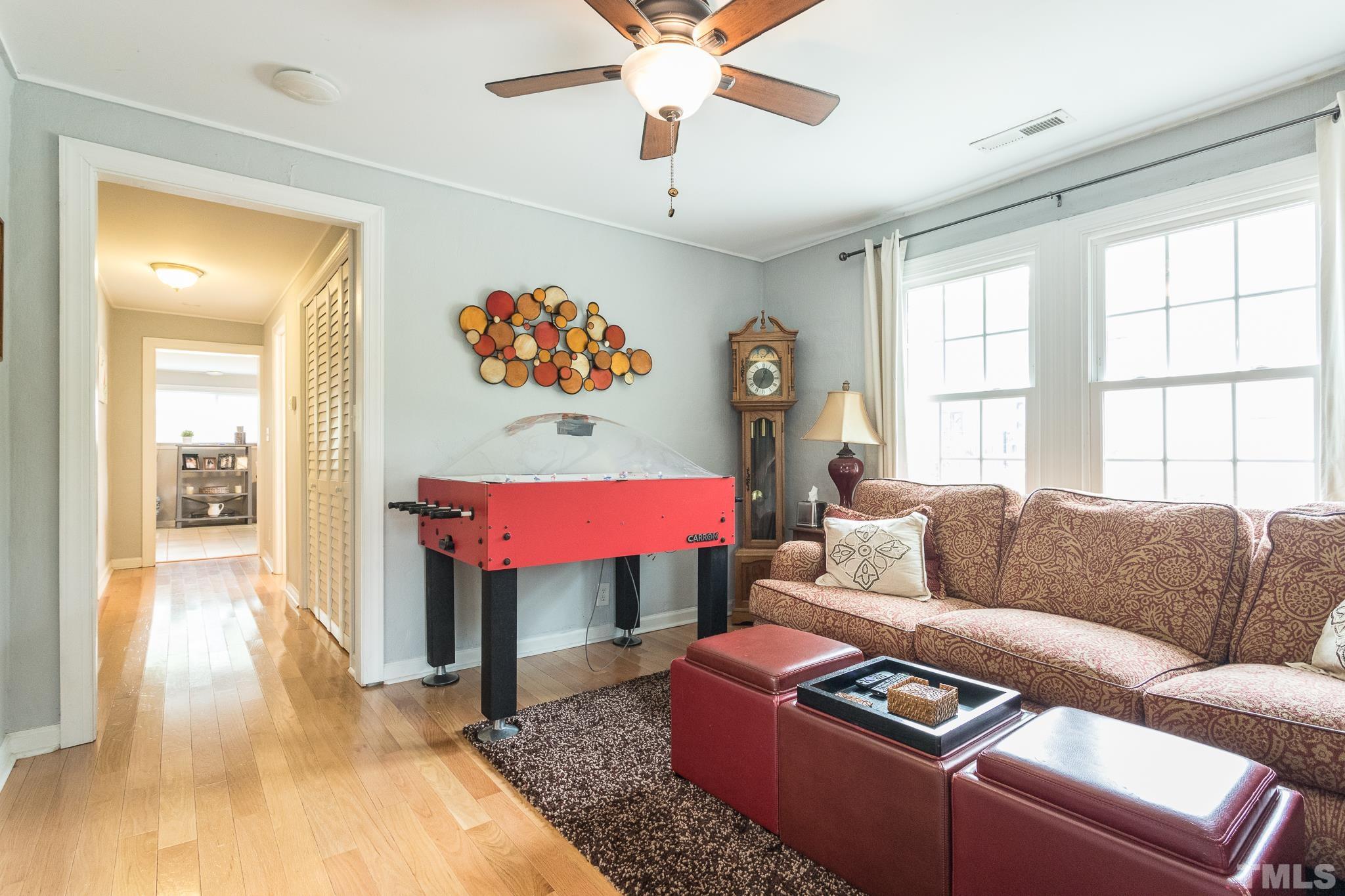 9117 Penny Road Raleigh, NC 27606 - Photo 41 of 54 a living room with furniture and a window