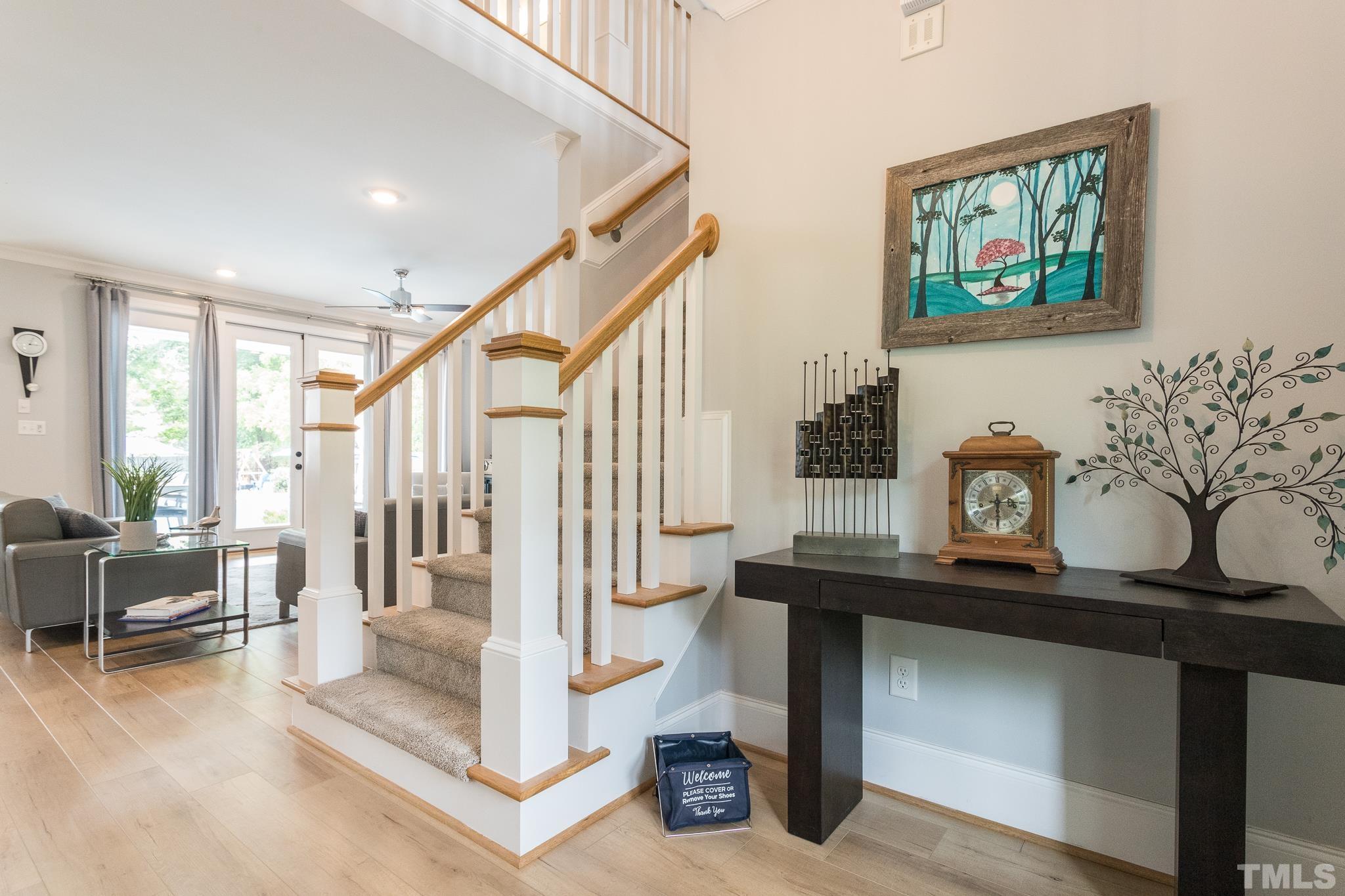 9117 Penny Road Raleigh, NC 27606 - Photo 7 of 54 a view of living room with furniture and windows