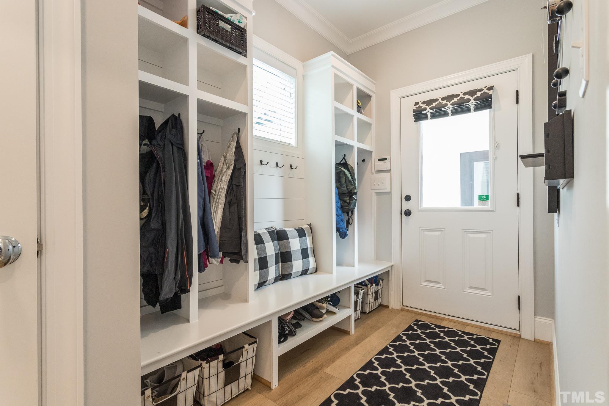 9117 Penny Road Raleigh, NC 27606 - Photo 10 of 54 a view of walk in closet with clothes and shoes