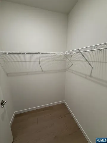 a kitchen with refrigerator cabinets and stove