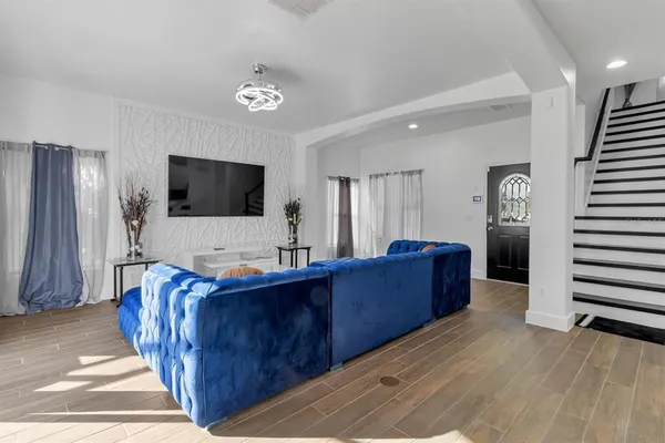a living room with furniture and a flat screen tv