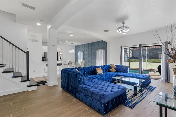 a living room with furniture and a large window