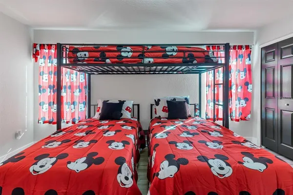 a bedroom with bed and a window