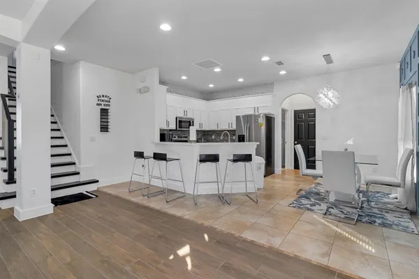 a view of kitchen with cabinets and wooden floor
