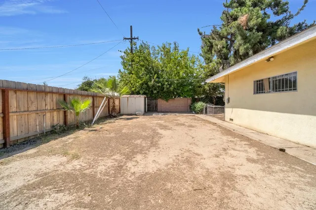 a view of a backyard of the house