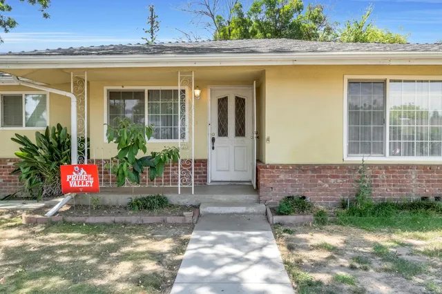 a front view of a house with a porch