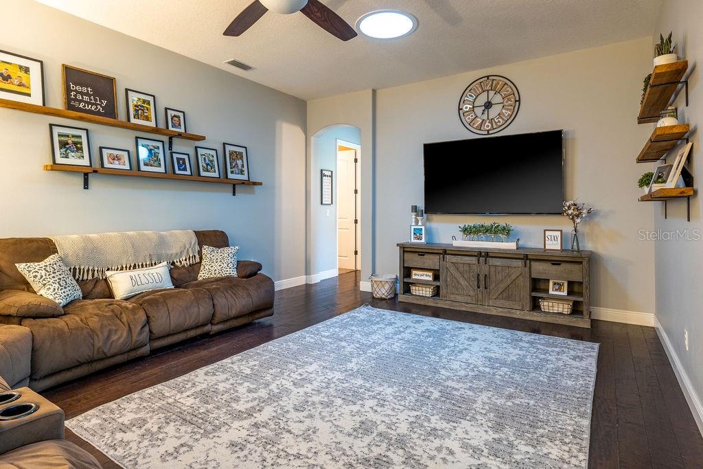 316 Old Mill Road Deltona, FL 32725 - Photo 15 of 64 a living room with furniture and a flat screen tv