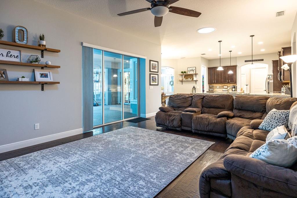 316 Old Mill Road Deltona, FL 32725 - Photo 16 of 64 a living room with furniture and a large window