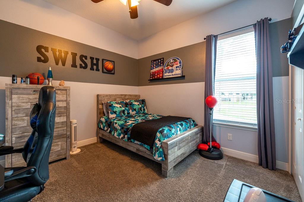316 Old Mill Road Deltona, FL 32725 - Photo 26 of 64 a bedroom with bed and a window