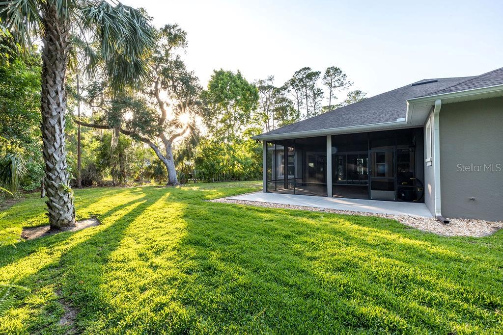 316 Old Mill Road Deltona, FL 32725 - Photo 32 of 64 a view of a house with swimming pool and a yard