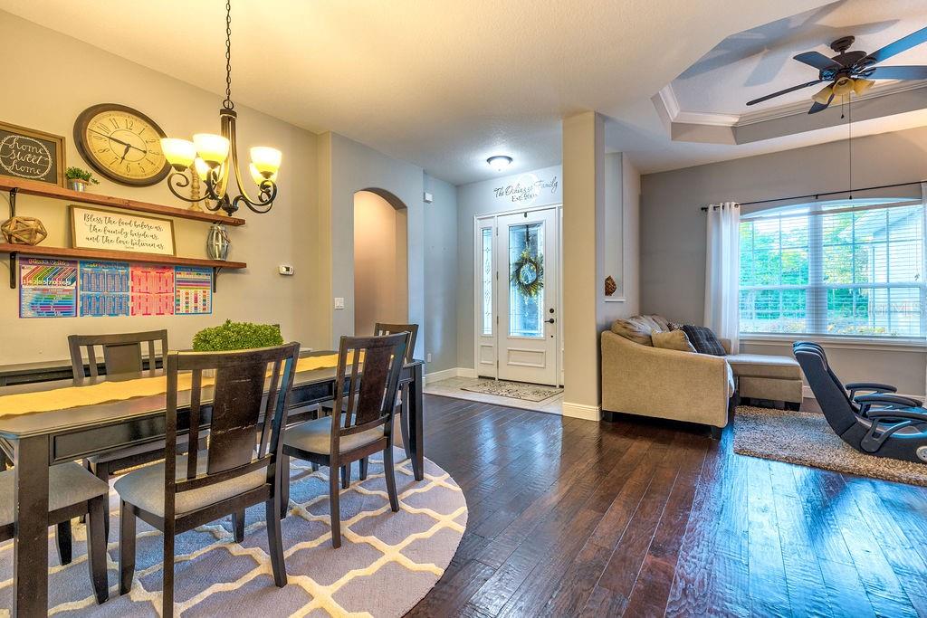 316 Old Mill Road Deltona, FL 32725 - Photo 4 of 64 a view of a dining room with furniture window and wooden floor