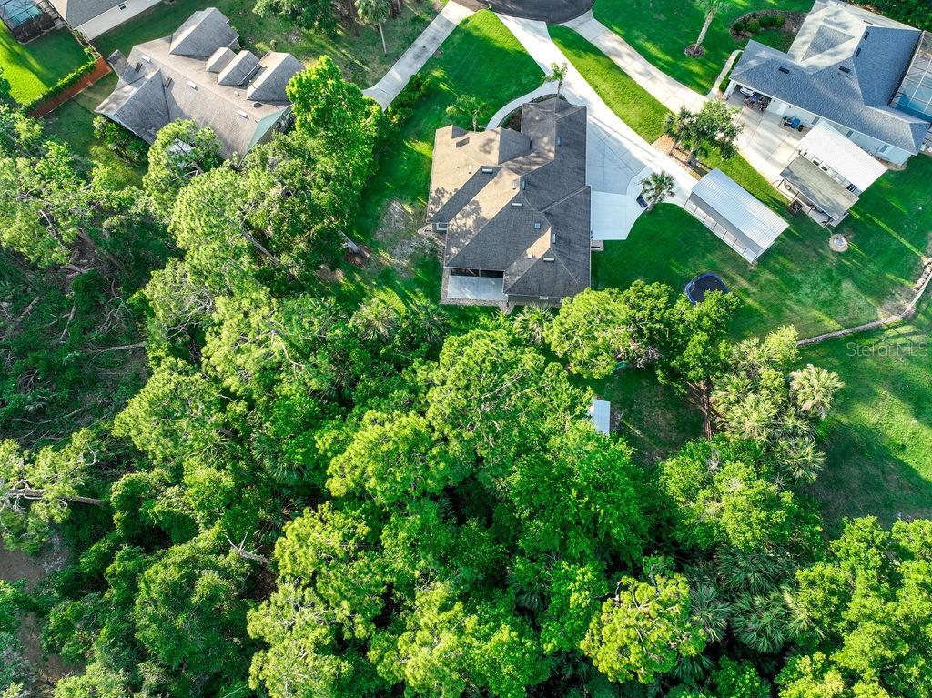 316 Old Mill Road Deltona, FL 32725 - Photo 43 of 64 an aerial view of a house with a yard