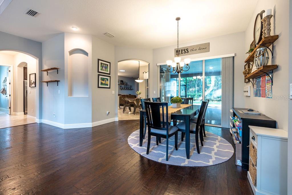 316 Old Mill Road Deltona, FL 32725 - Photo 5 of 64 a view of a dining room with furniture window and wooden floor