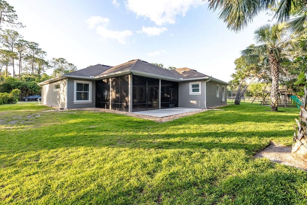 316 Old Mill Road Deltona, FL 32725 - Photo 56 of 64 a view of a house with a backyard