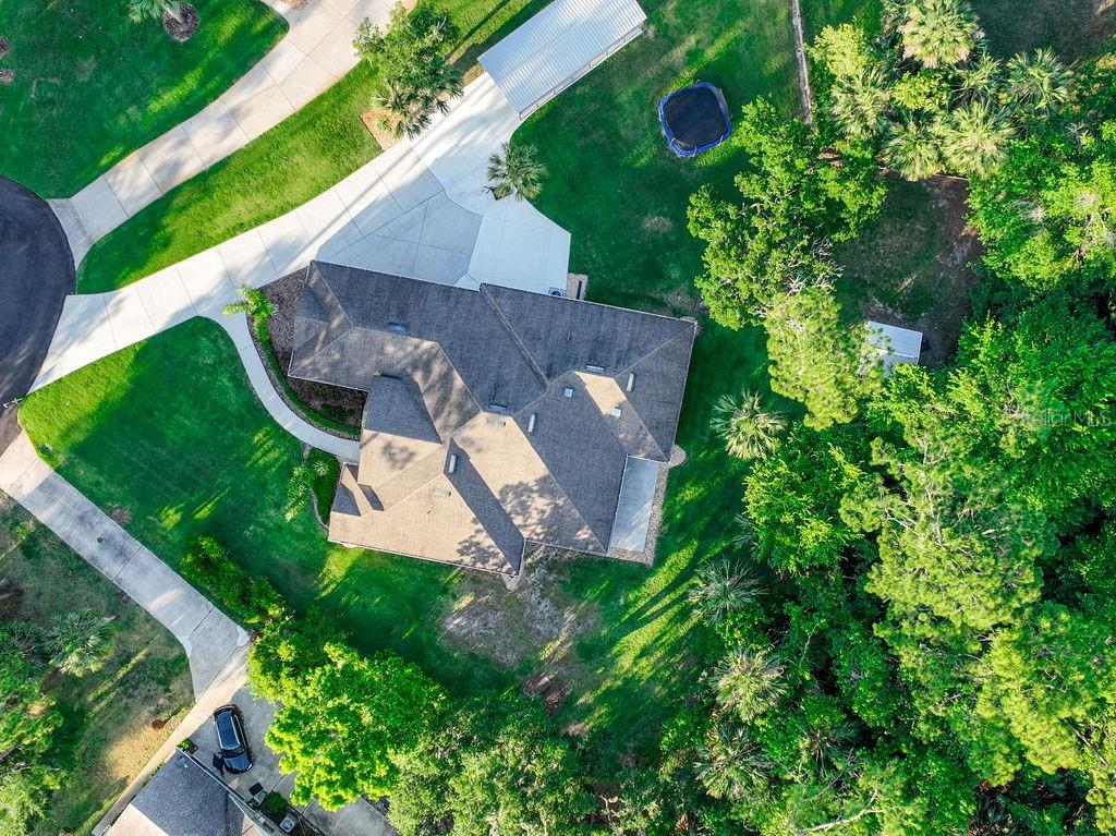 316 Old Mill Road Deltona, FL 32725 - Photo 59 of 64 an aerial view of a house with a yard