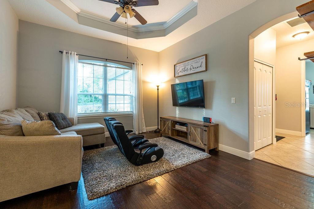 316 Old Mill Road Deltona, FL 32725 - Photo 6 of 64 a living room with furniture and a flat screen tv