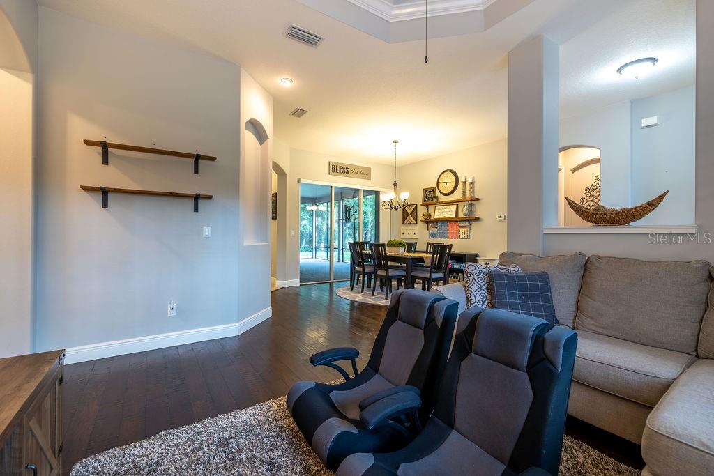 316 Old Mill Road Deltona, FL 32725 - Photo 7 of 64 a living room with furniture and a large window