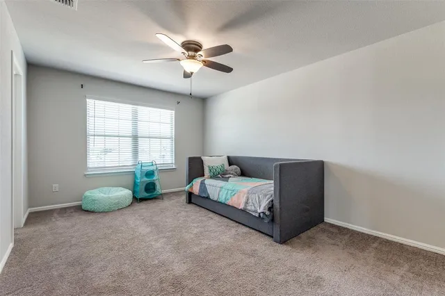 a living room with furniture and windows