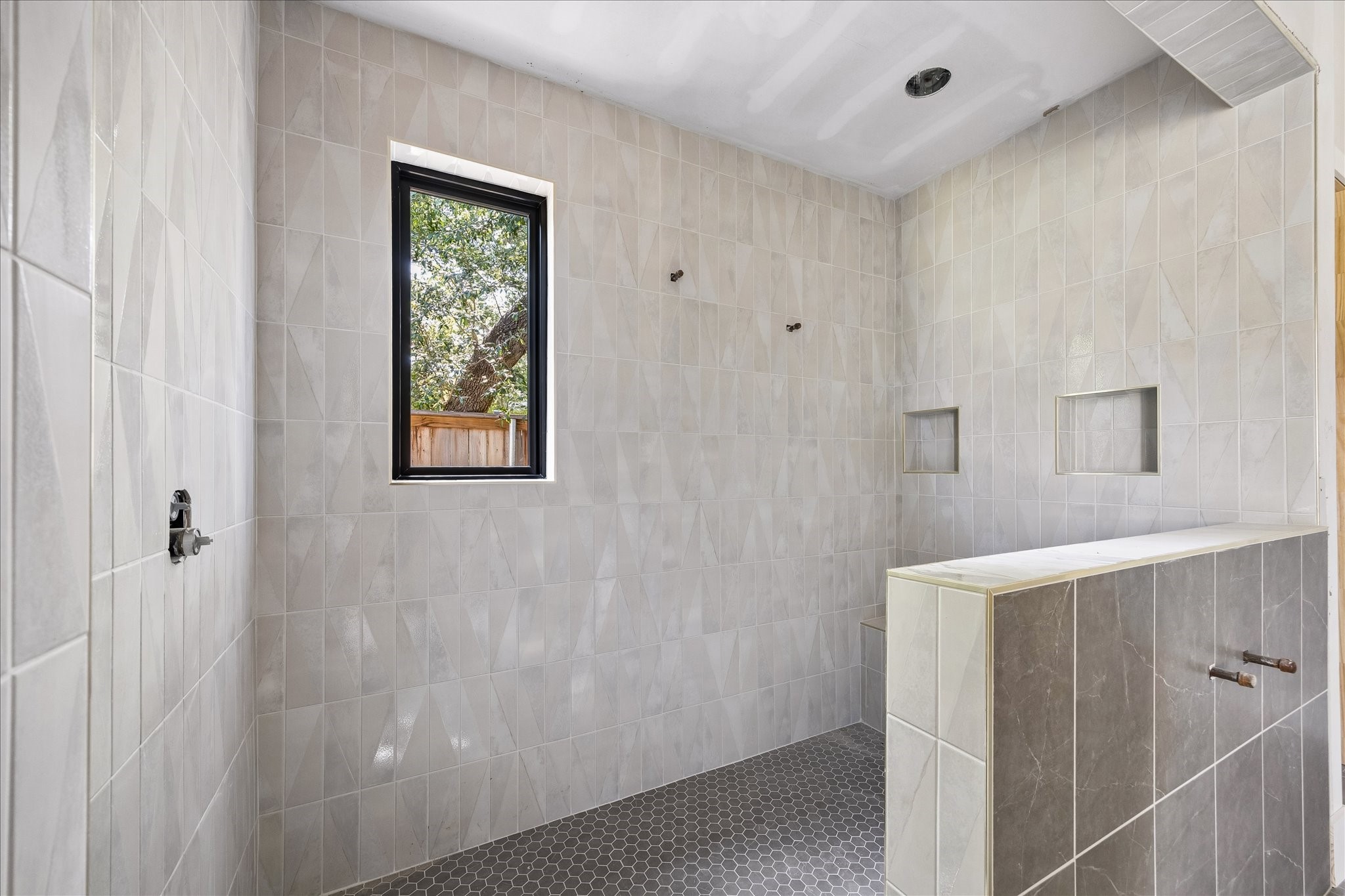 9050 Elizabeth Road Houston, TX 77055 - Photo 19 of 40 a bathroom with a shower