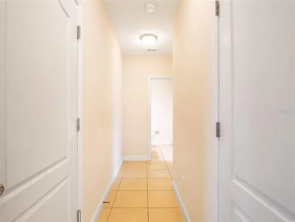 a view of a bathroom from a hallway