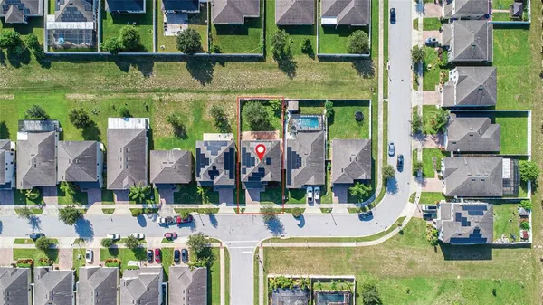 a view of multiple houses with outdoor space