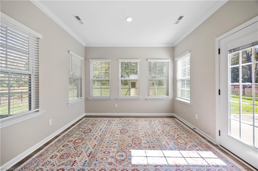 180 Moravian Advance, NC 27006 - Photo 13 of 34 Sunroom with views of the woods.