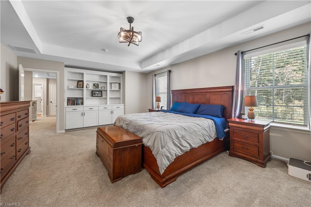 180 Moravian Advance, NC 27006 - Photo 18 of 34 Wonderful primary bedroom with custom built-ins.