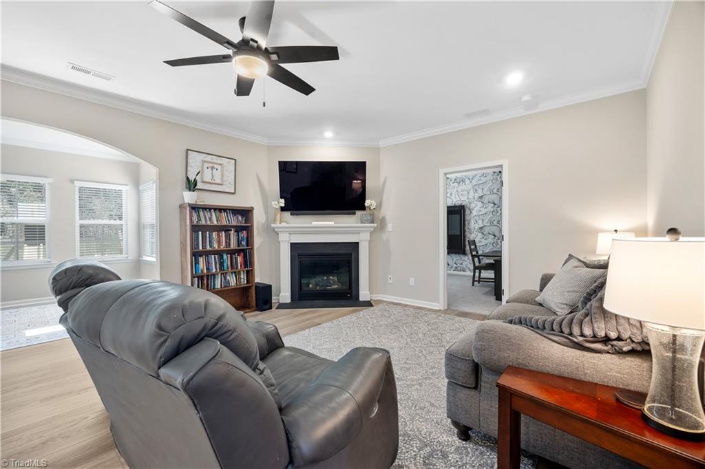 180 Moravian Advance, NC 27006 - Photo 10 of 34 Family room features a gas fireplace.