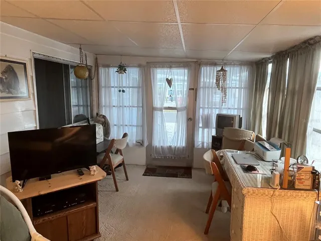 a room with furniture and a window