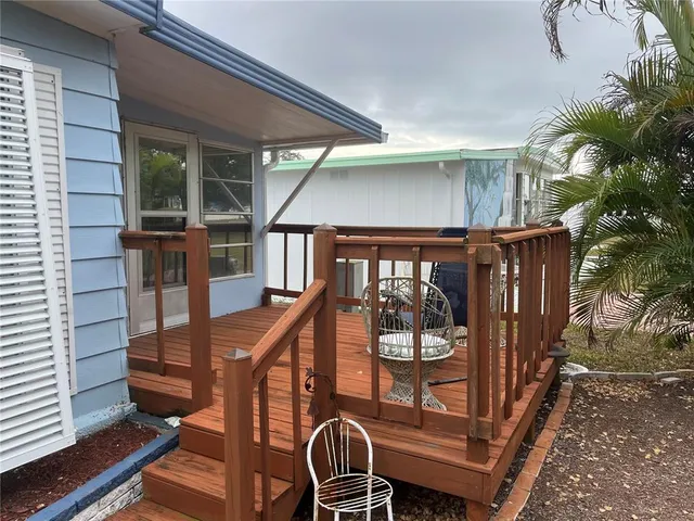 a view of balcony with furniture and deck