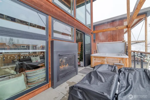 a front view of a house with outdoor seating