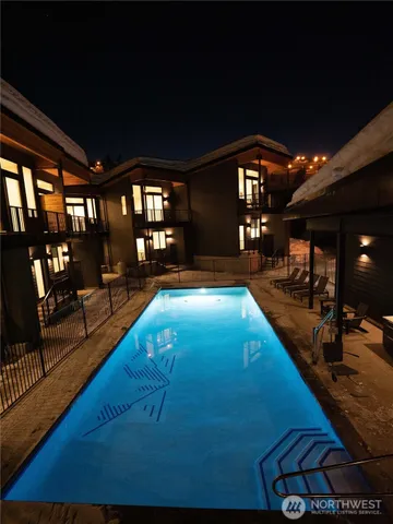 a room with lots of swimming pool and furniture