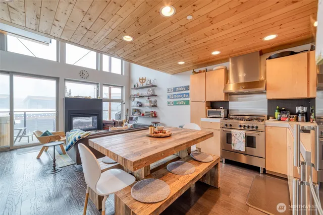 a kitchen with a stove a sink and a refrigerator