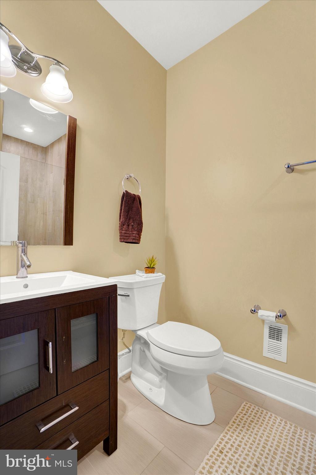 14507 Ventry Farm Court Sparks Glencoe, MD 21152 - Photo 27 of 87 a bathroom with a toilet a sink and mirror