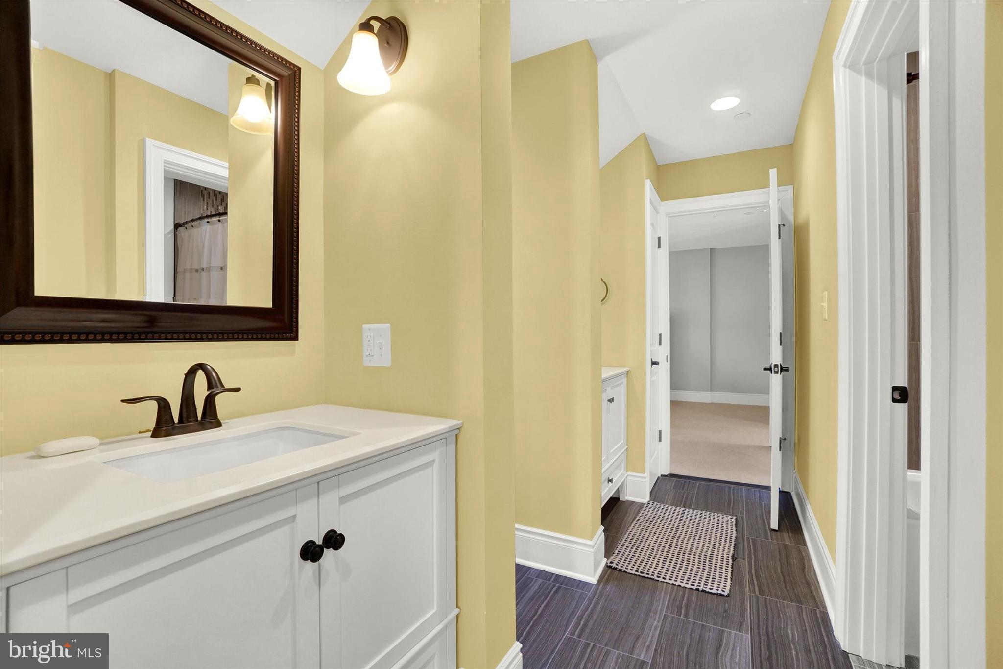 14507 Ventry Farm Court Sparks Glencoe, MD 21152 - Photo 41 of 87 a bathroom with a sink a mirror and a shower
