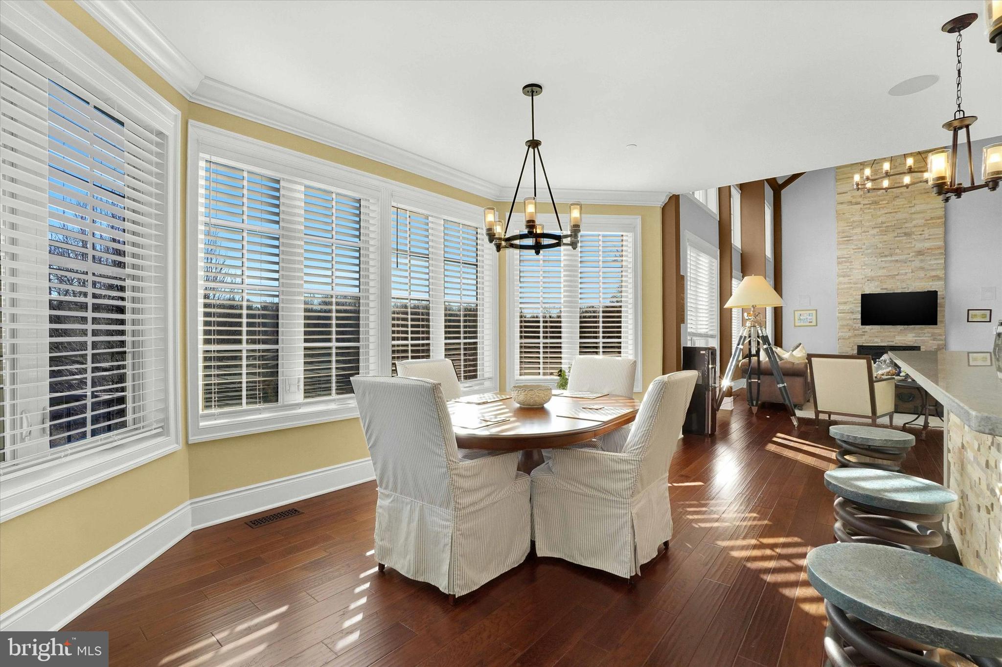 14507 Ventry Farm Court Sparks Glencoe, MD 21152 - Photo 10 of 87 a dining room with wooden floor a chandelier windows and wooden floor