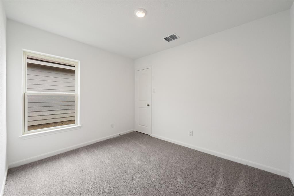 585 Aplite Pass Maxwell, TX 78656 - Photo 12 of 13 a view of an empty room with a window