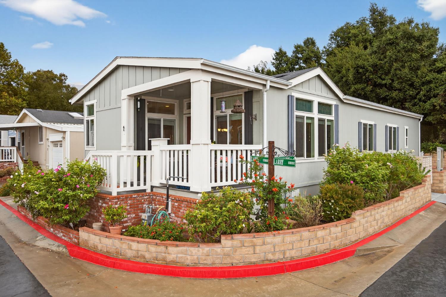 1885 Maricopa Highway, Unit 1 Ojai, CA 93023 - Photo 1 of 36 a front view of a house with a yard