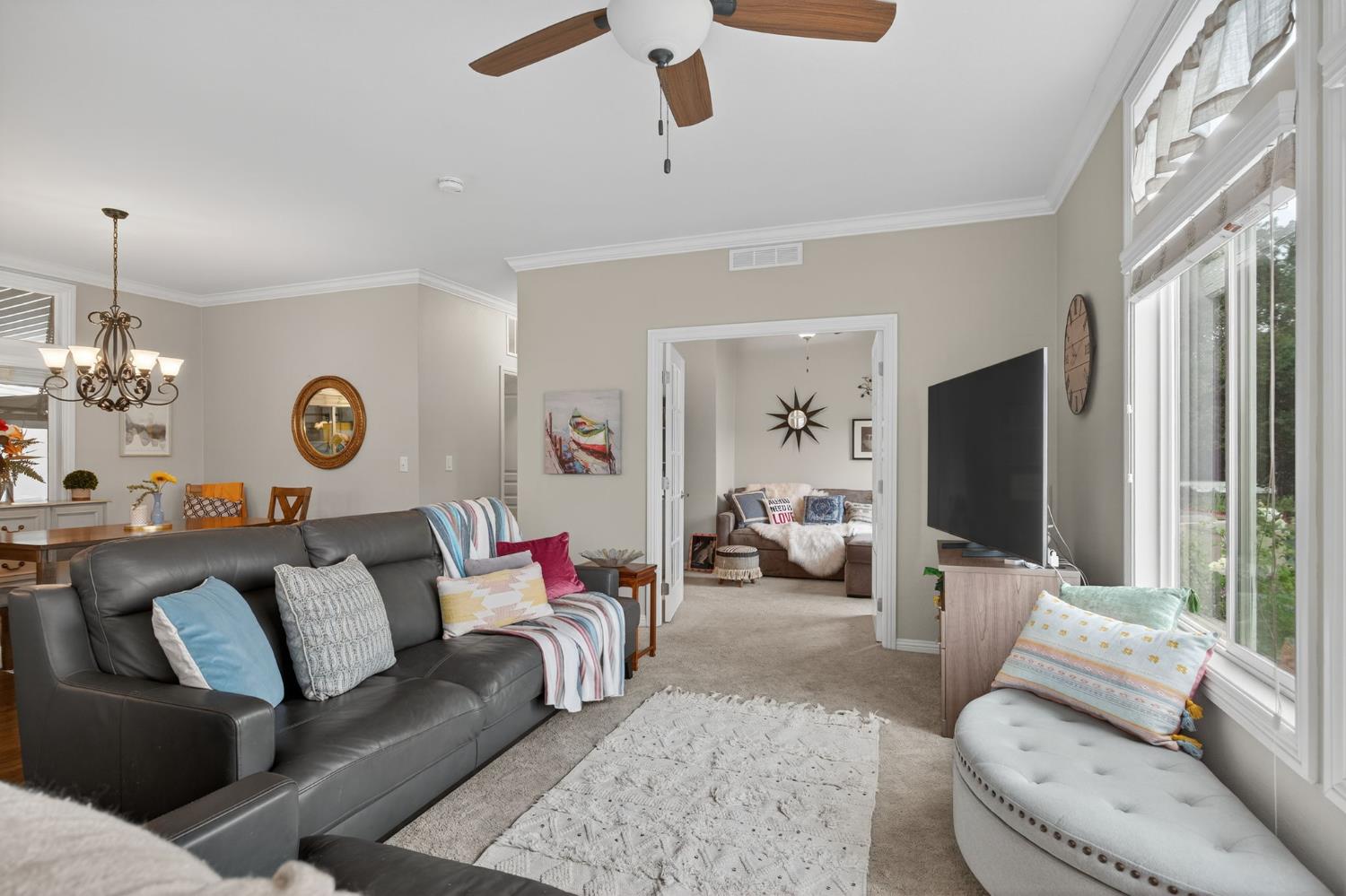 1885 Maricopa Highway, Unit 1 Ojai, CA 93023 - Photo 11 of 36 a living room with furniture and a flat screen tv