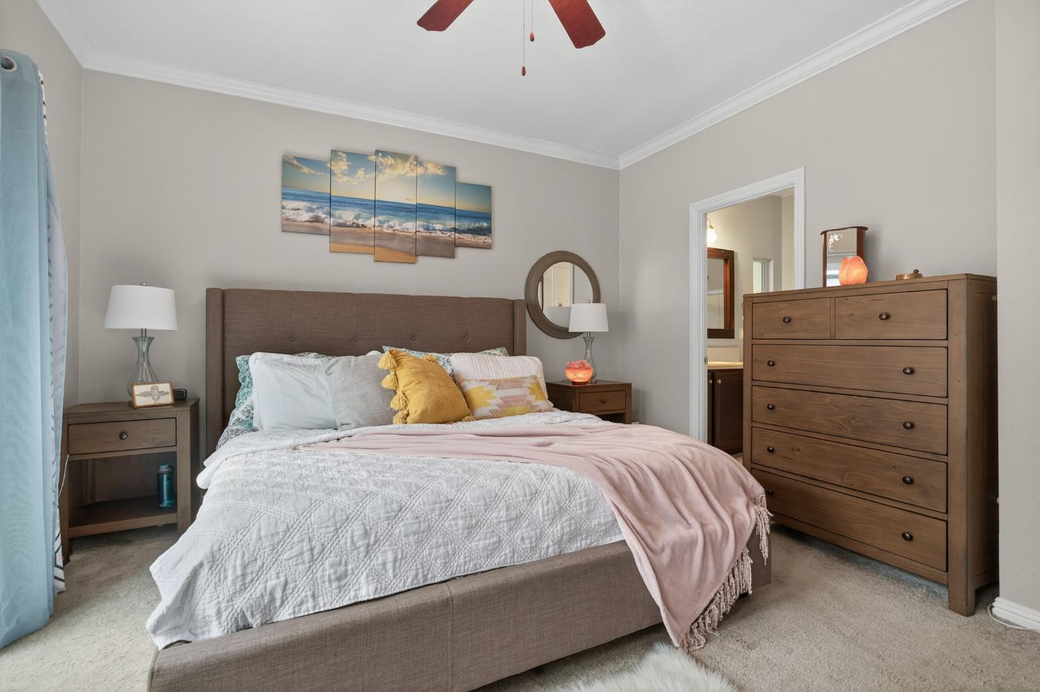 1885 Maricopa Highway, Unit 1 Ojai, CA 93023 - Photo 25 of 36 a bedroom with a bed and a chandelier