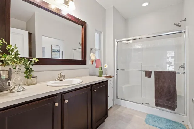 a bathroom with a shower and a sink