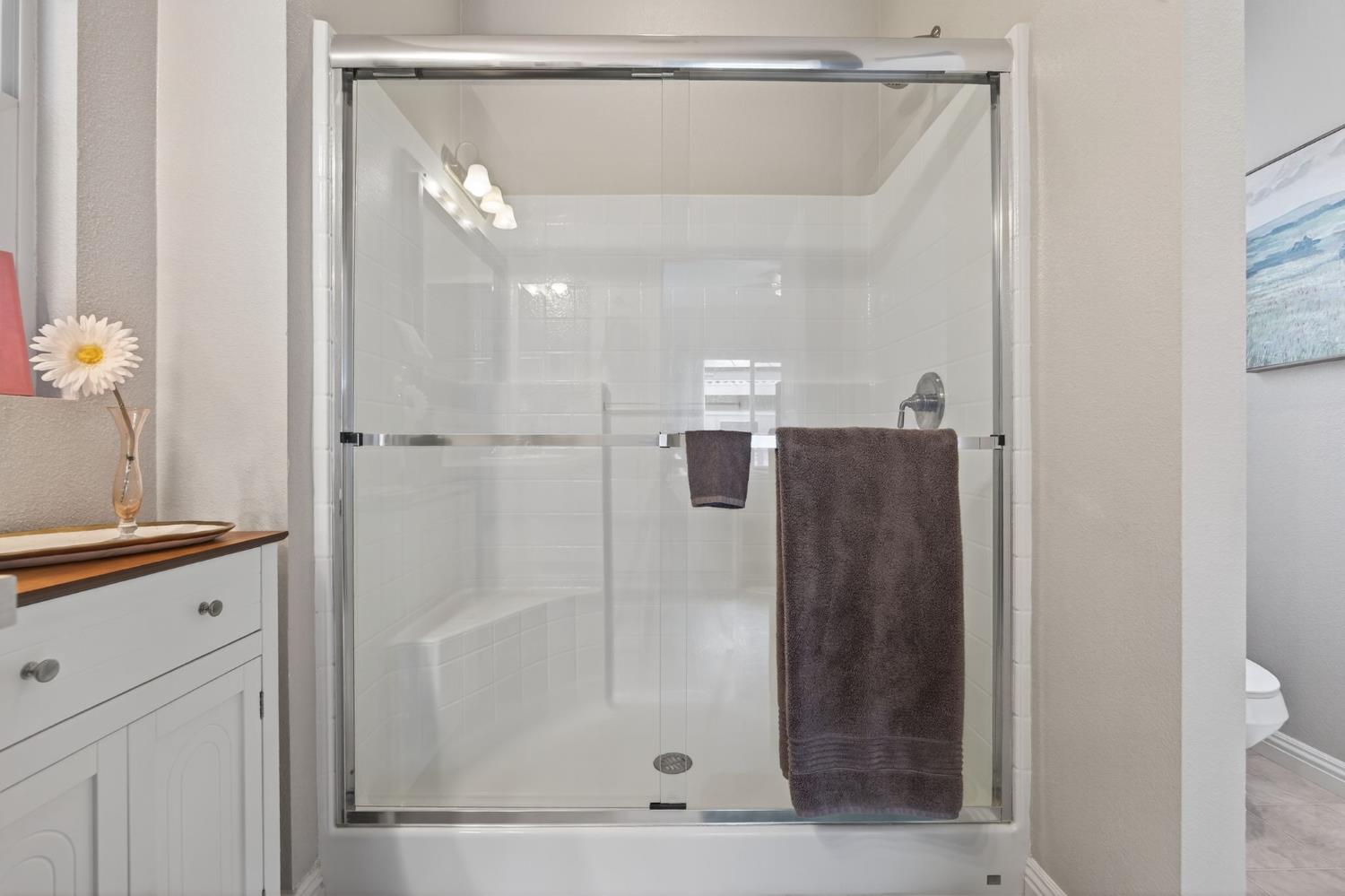 1885 Maricopa Highway, Unit 1 Ojai, CA 93023 - Photo 29 of 36 a bathroom with a shower and a sink