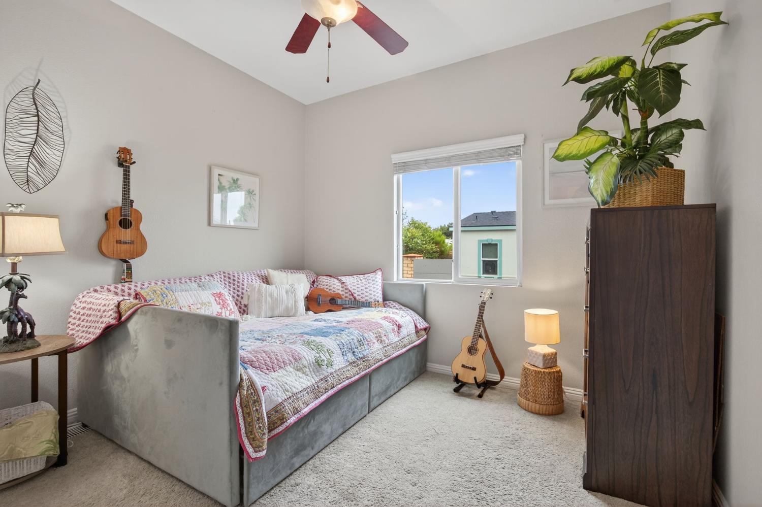 1885 Maricopa Highway, Unit 1 Ojai, CA 93023 - Photo 30 of 36 a bedroom with a bed and a chandelier