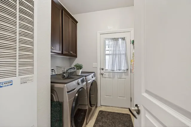 a living room with a couch and a stove top oven