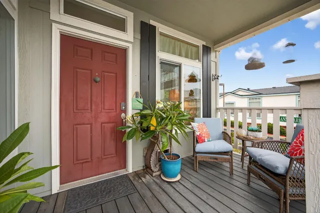 a dining room with furniture potted plant and a window